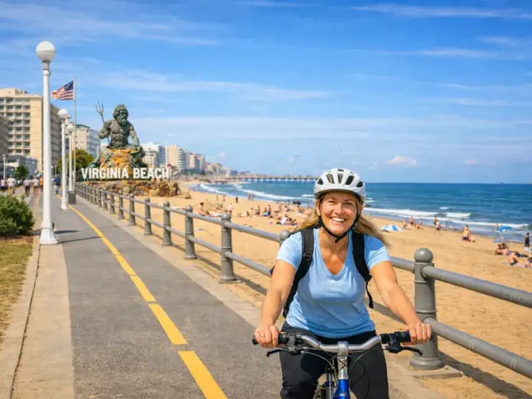 A woman riding a bicycle along a path in Virginia Beach
